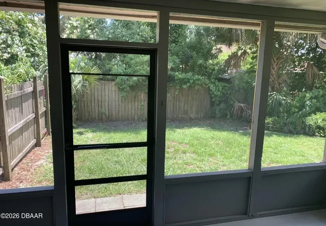 a view of backyard and deck