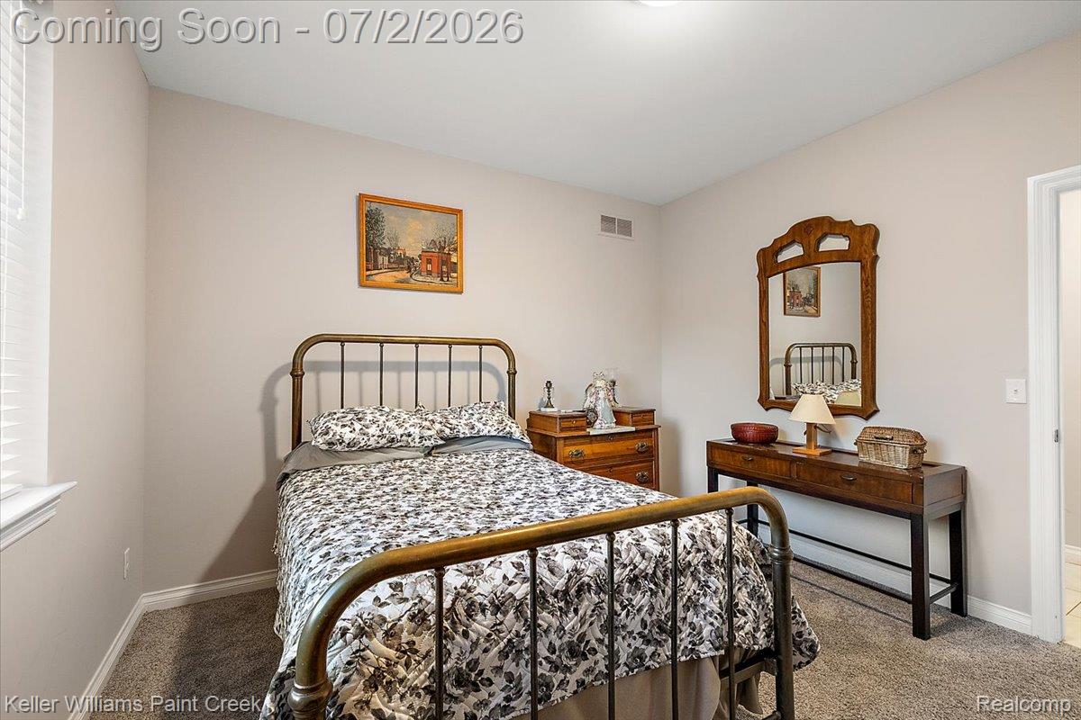 54230 Card Road Macomb, MI 48042 - Photo 57 of 73 Carpeted bedroom with neutral wall tones and white baseboard trim