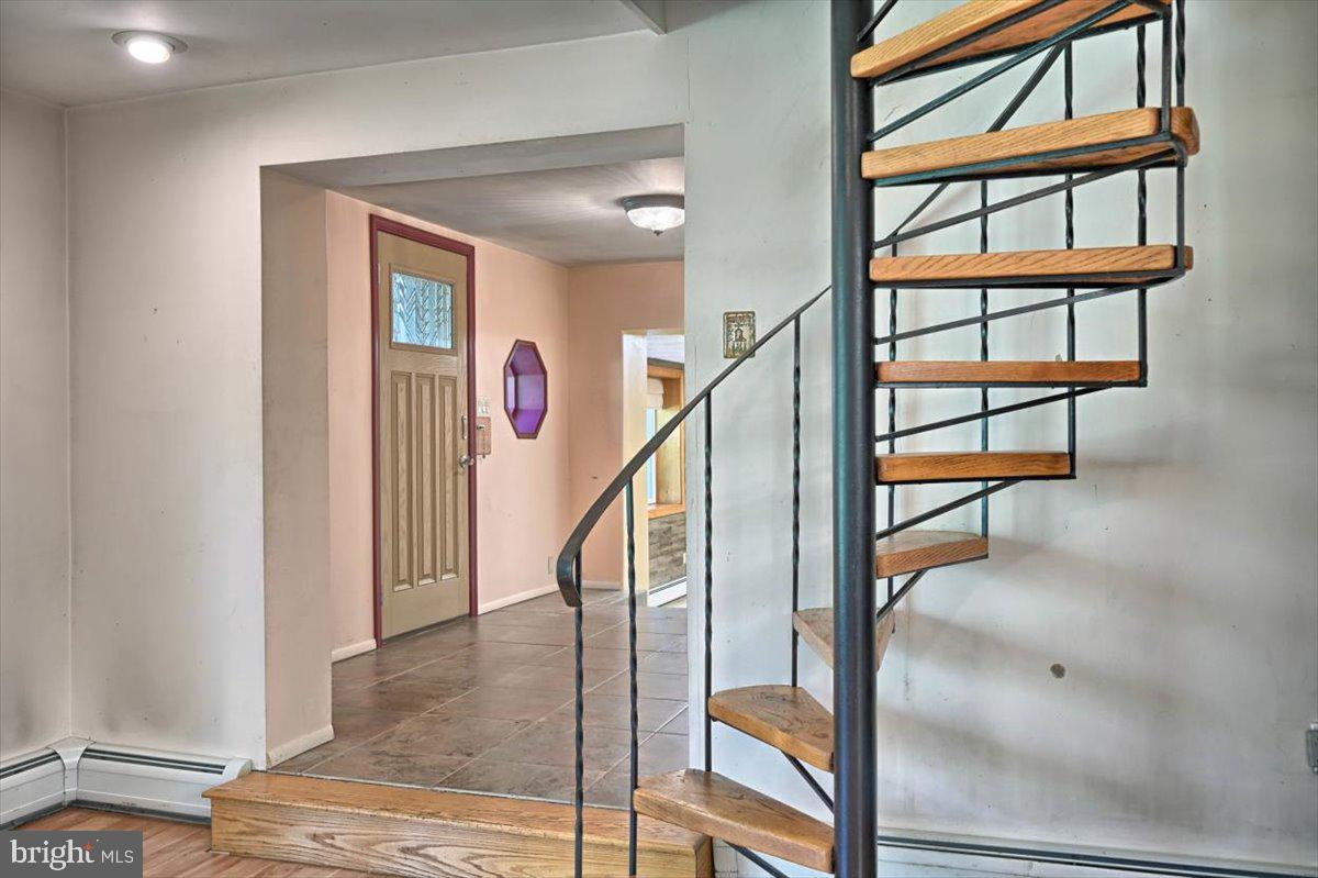 534 Truce Road New Providence, PA 17560 - Photo 18 of 46 Spiral Staircase Leads to Upper Level