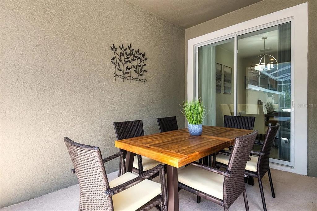 400 Ocean Course Avenue Davenport, FL 33896 - Photo 17 of 34 a view of a dining room with furniture and window