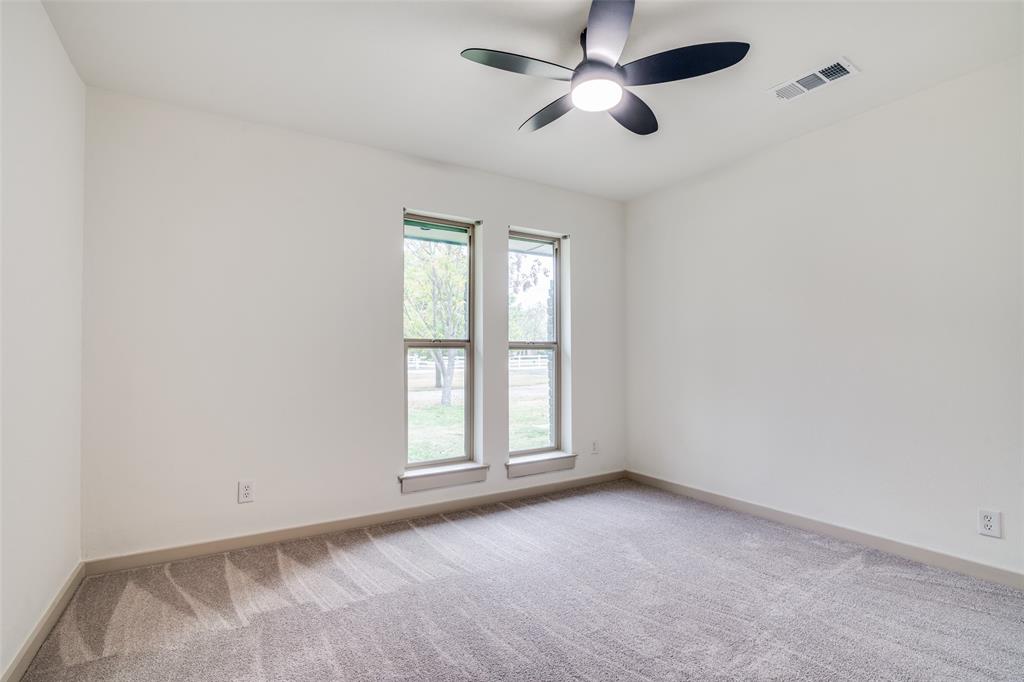 5109 Old Gate Lane Parker, TX 75002 - Photo 15 of 24 an empty room with windows and fan