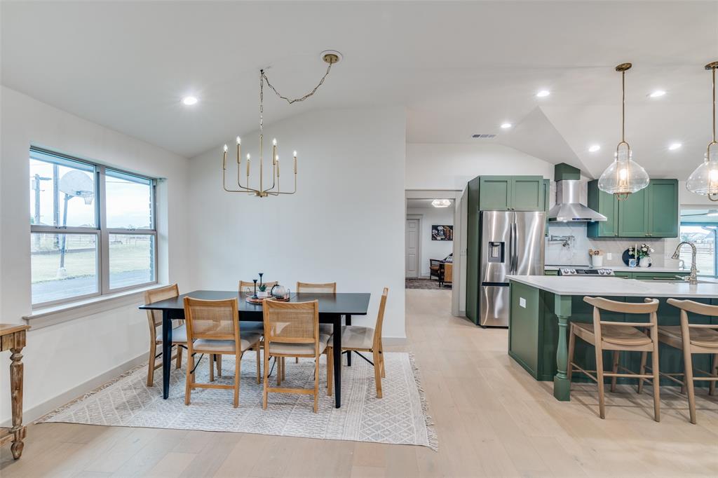 5109 Old Gate Lane Parker, TX 75002 - Photo 8 of 24 a view of a dining room with furniture a chandelier and wooden floor