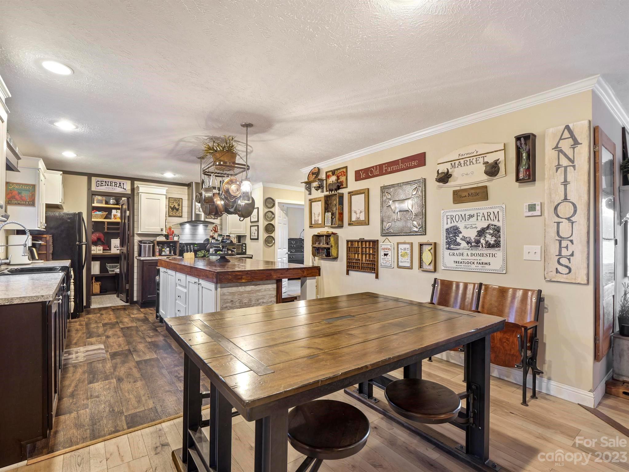 139 Phils Circle Rutherfordton, NC 28139 - Photo 14 of 37 a dining room with wooden floor and large glass windows