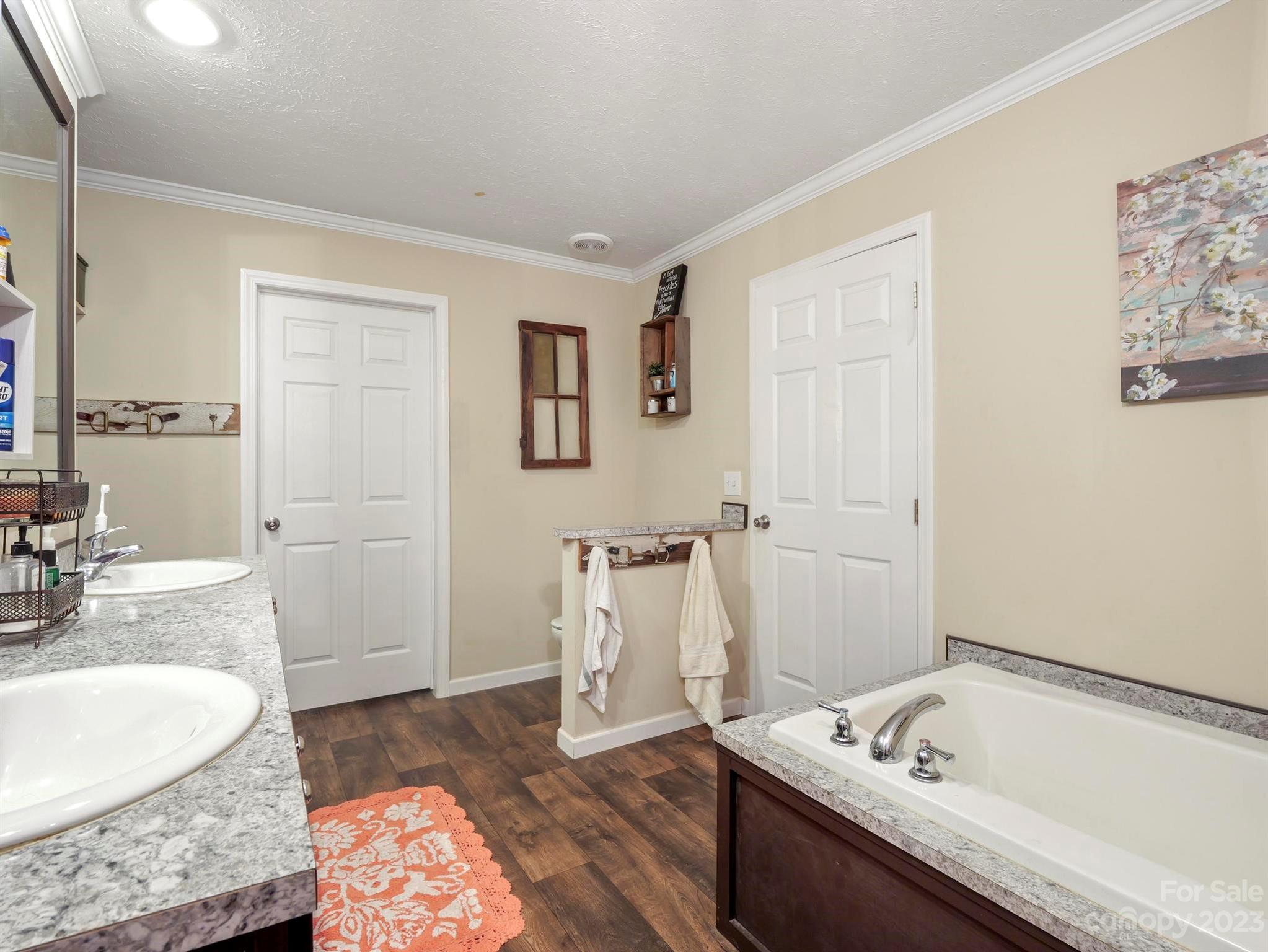 139 Phils Circle Rutherfordton, NC 28139 - Photo 22 of 37 a bathroom with a tub sink and mirror