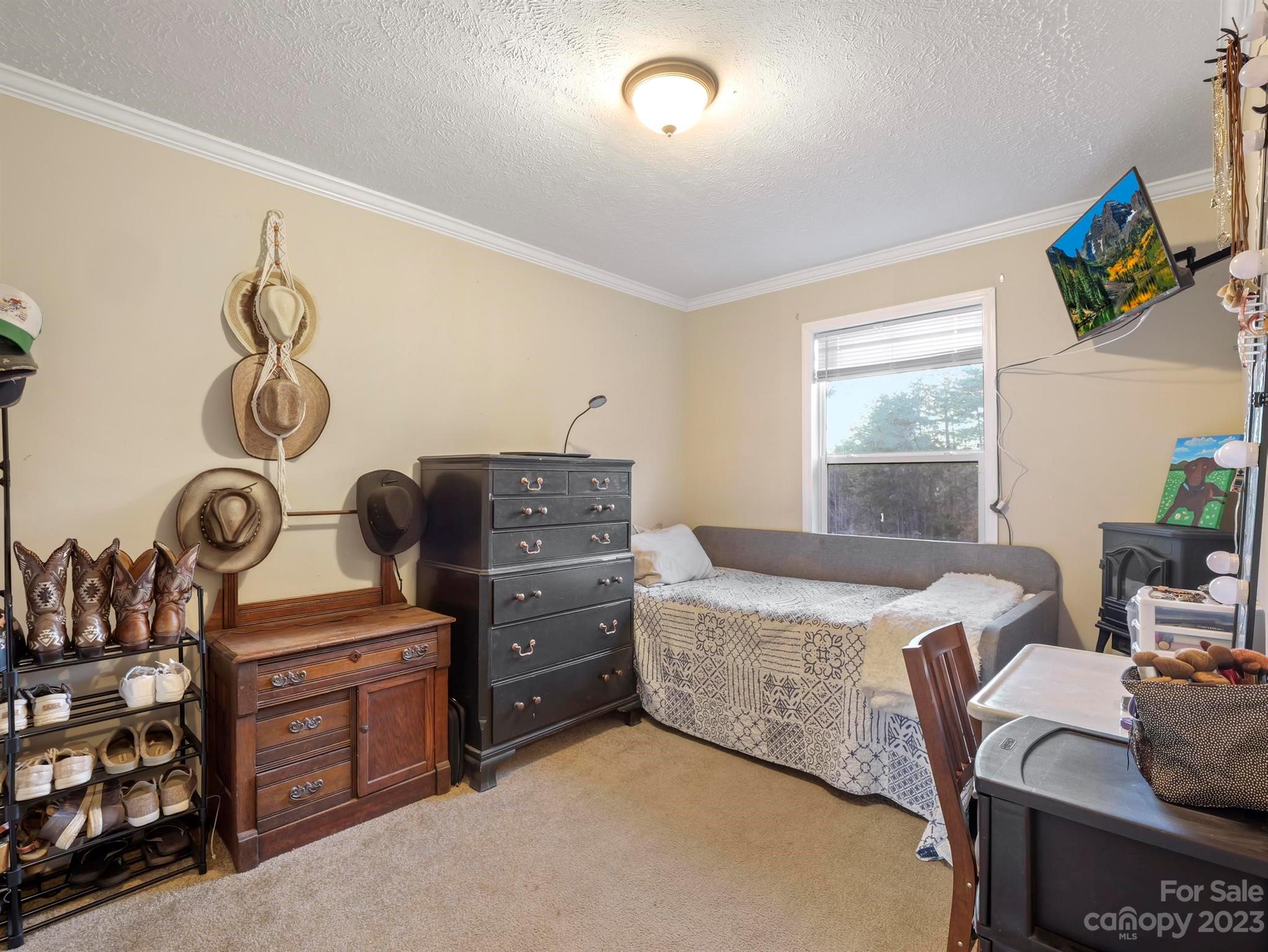 139 Phils Circle Rutherfordton, NC 28139 - Photo 23 of 37 a bedroom with a bed and a window