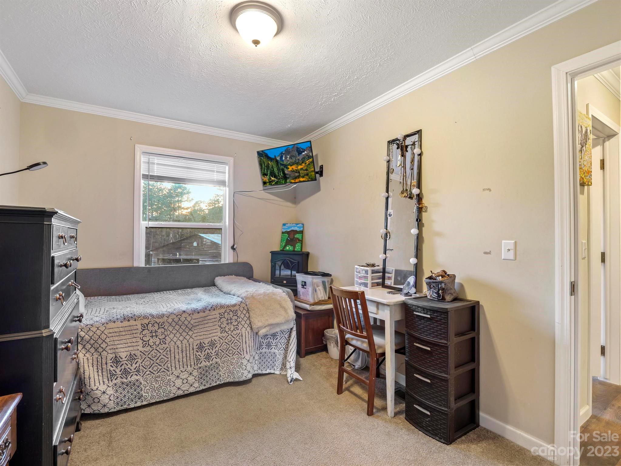 139 Phils Circle Rutherfordton, NC 28139 - Photo 24 of 37 a bedroom with bed and a window