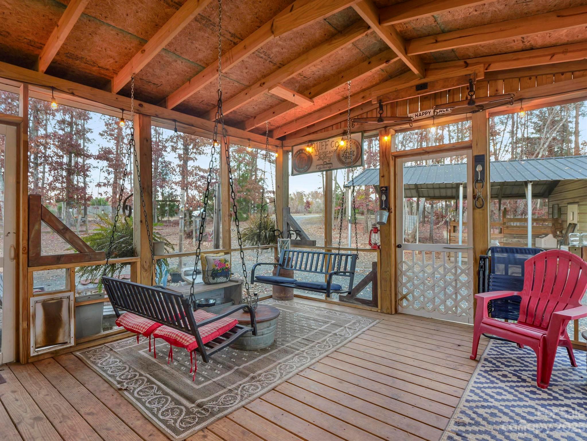 139 Phils Circle Rutherfordton, NC 28139 - Photo 28 of 37 a balcony with chairs and wooden floor