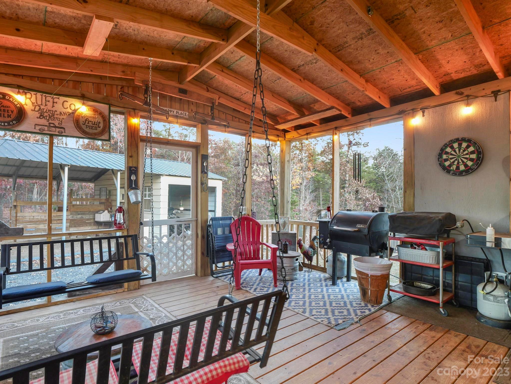 139 Phils Circle Rutherfordton, NC 28139 - Photo 29 of 37 a view of a chairs and table in the patio and a wooden deck