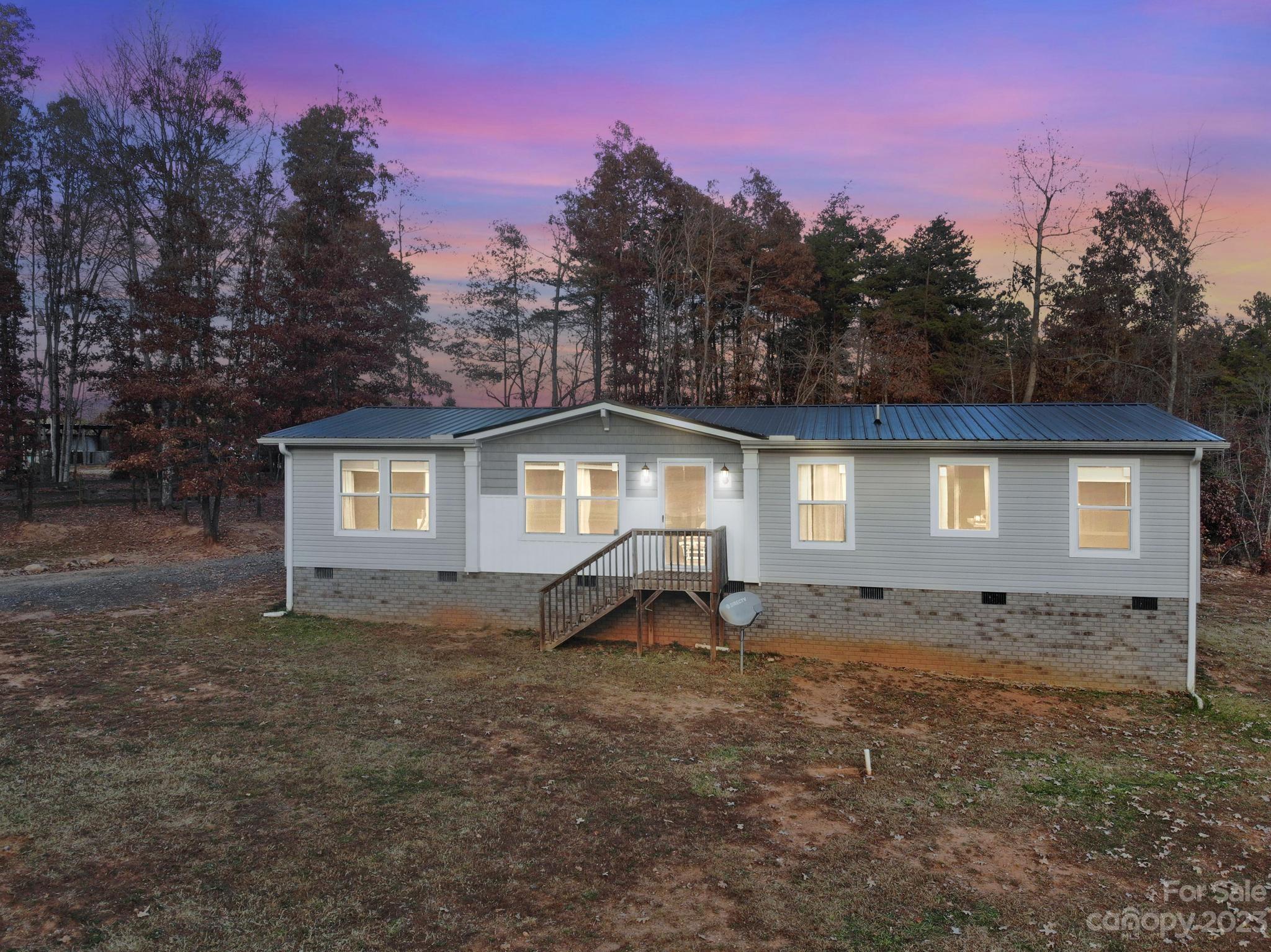139 Phils Circle Rutherfordton, NC 28139 - Photo 9 of 37 a front view of a house with a yard