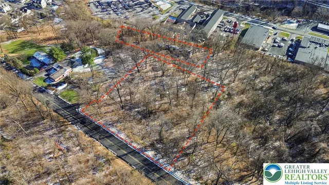 a backyard of a house with large trees