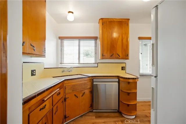a view of a kitchen with a sink and cabinets