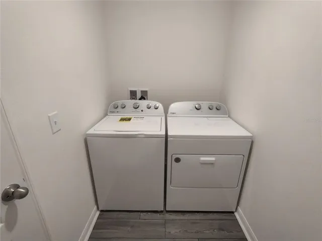 an empty room with wooden floor