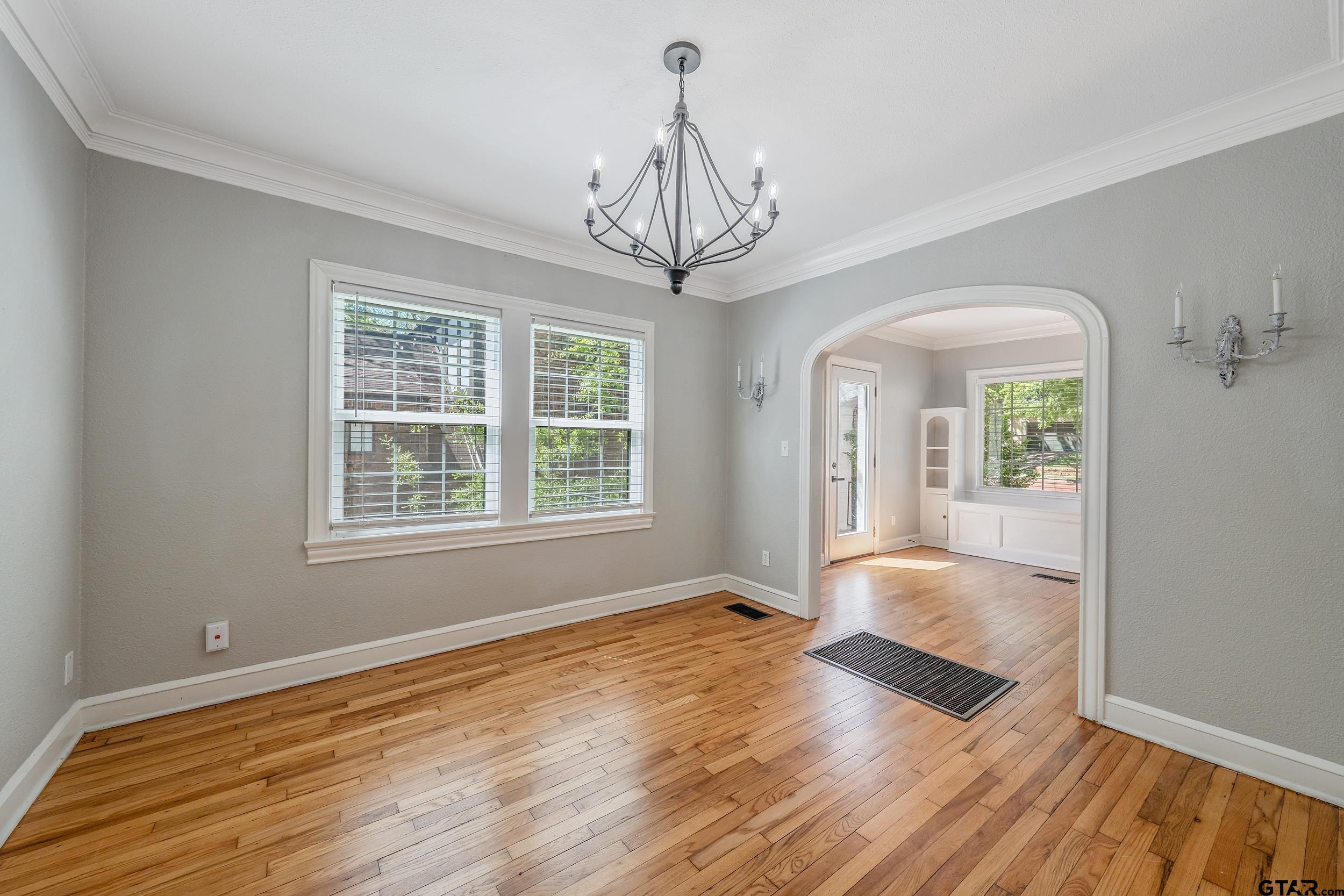 434 South Vine Avenue Tyler, TX 75702 - Photo 12 of 29 a view of empty room with wooden floor and fan