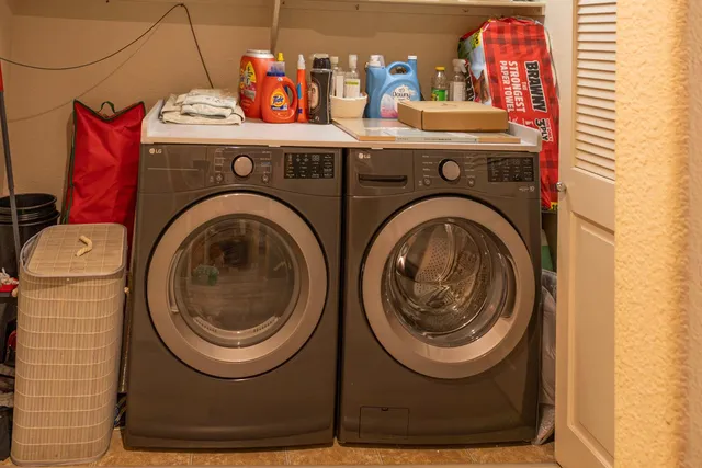 a utility room with dryer and washer