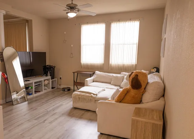 a living room with furniture and a window