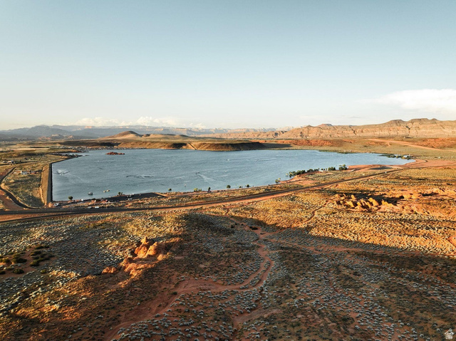 1693 Devils Gdn Lane Washington, UT 84780 - Photo 54 of 64 Expansive lake with a concrete dam and surrounding desert landscape
