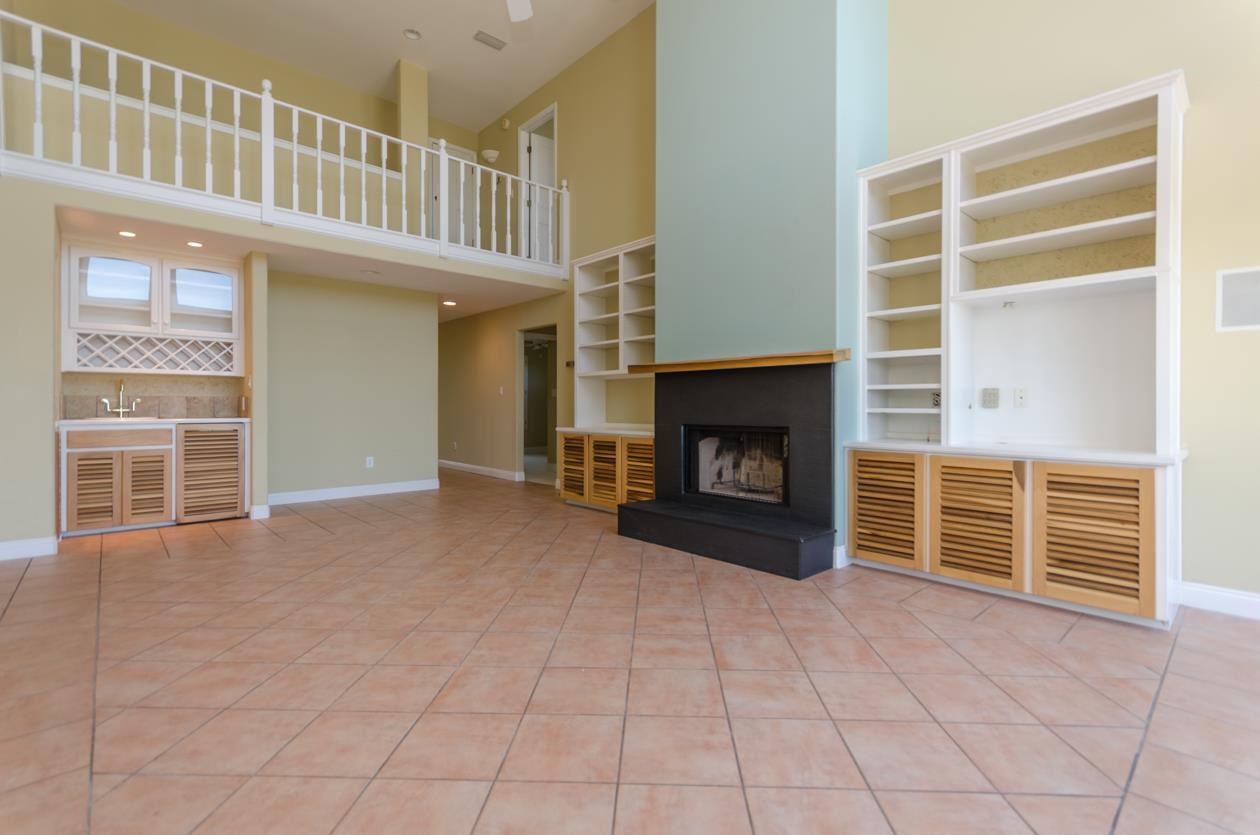 32548 River Road Orange Beach, AL 36561 - Photo 8 of 49 Beautiful built-in bookshelves and fireplace