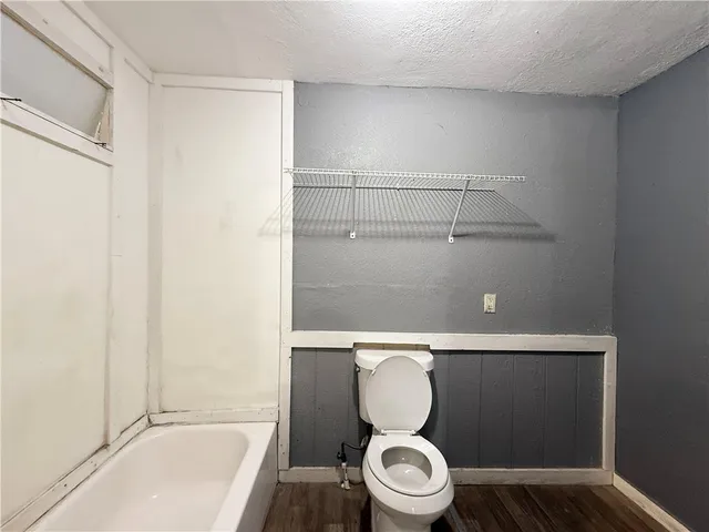 a bathroom with a toilet and a sink