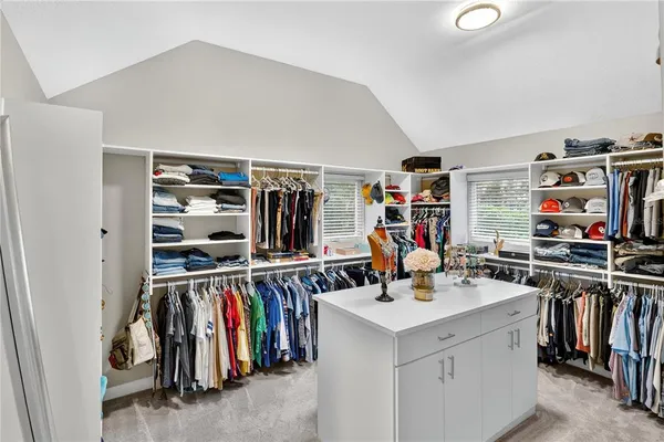 a view of a bedroom with wooden floor and workspace