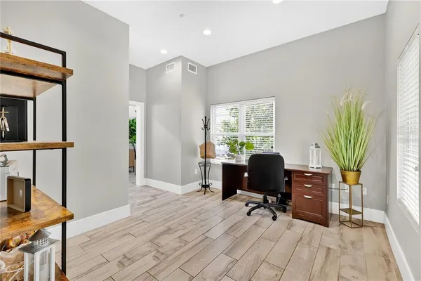 a bedroom with a bed couch and window