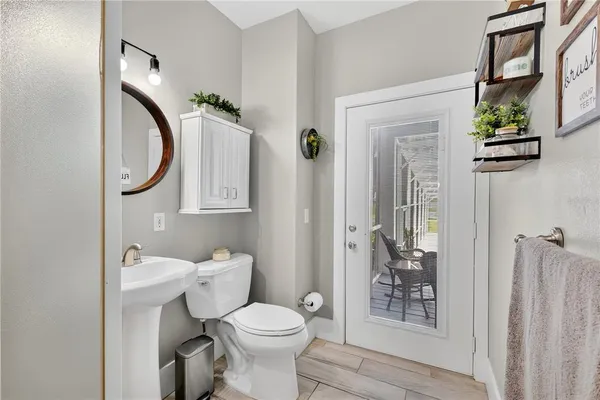 a view of a bedroom with furniture and window