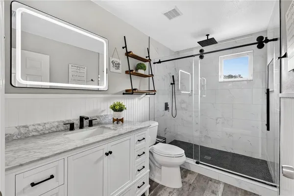 a bedroom with bed and a window