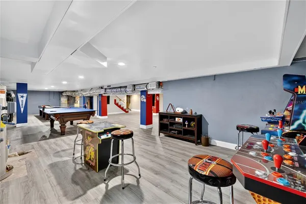 a view of a living room with furniture and garden view
