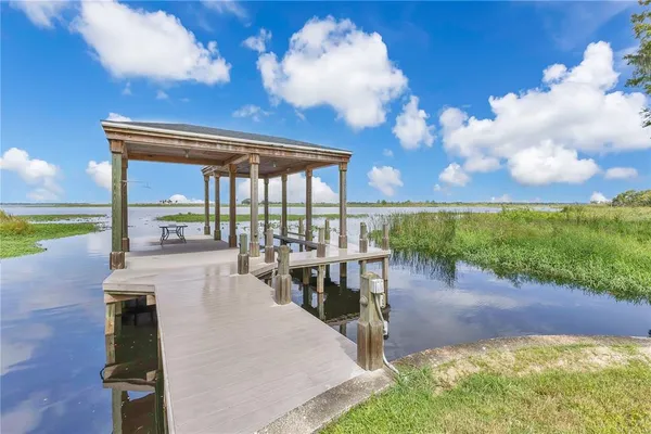 a view of a patio with swimming pool table and chairs
