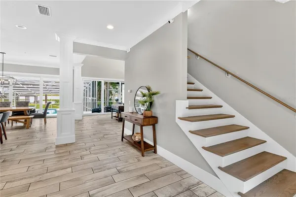 a kitchen with stainless steel appliances granite countertop a kitchen island a stove and a sink