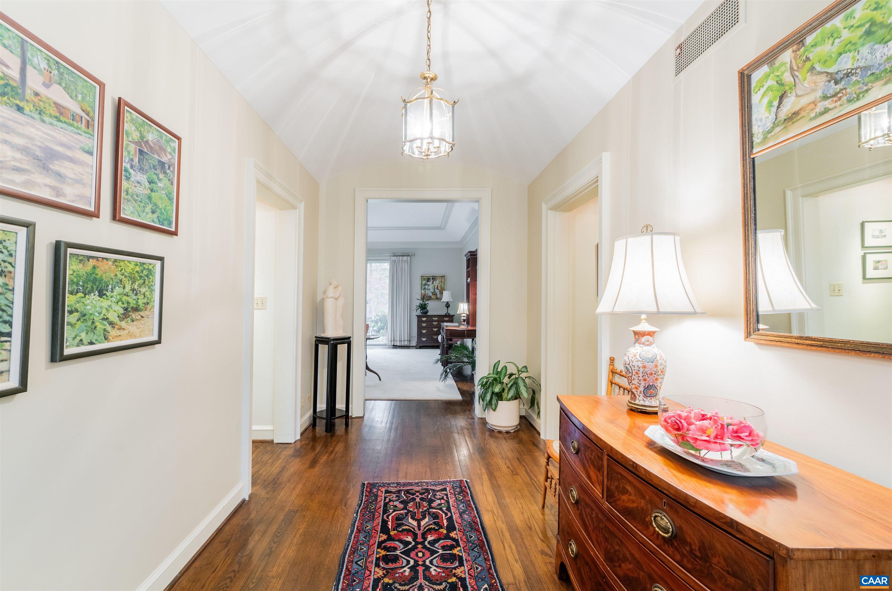 275 Terrell Road West Charlottesville, VA 22901 - Photo 12 of 68 a hallway with dining room and wooden floor