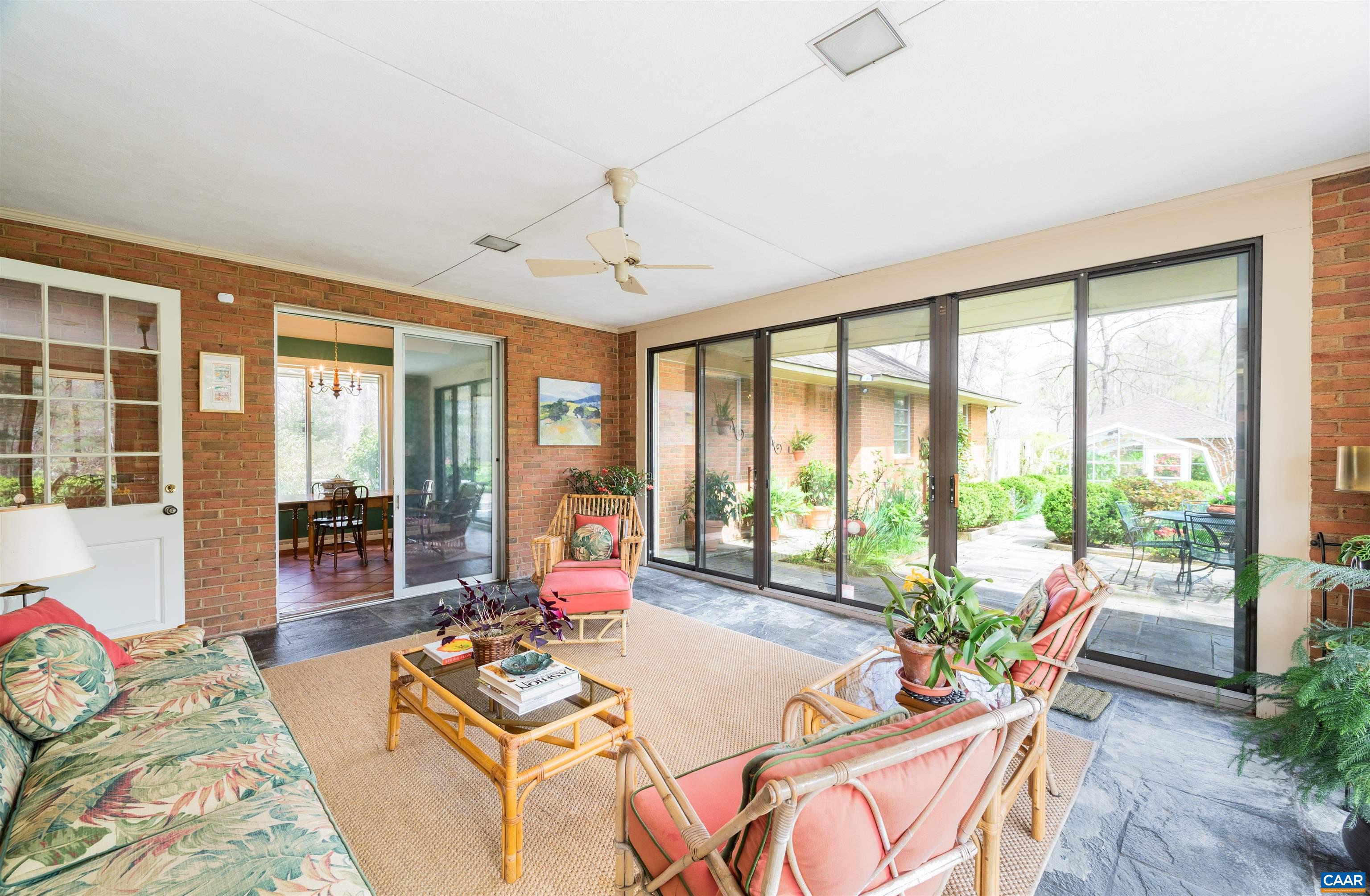 275 Terrell Road West Charlottesville, VA 22901 - Photo 19 of 68 a living room with furniture and floor to ceiling windows