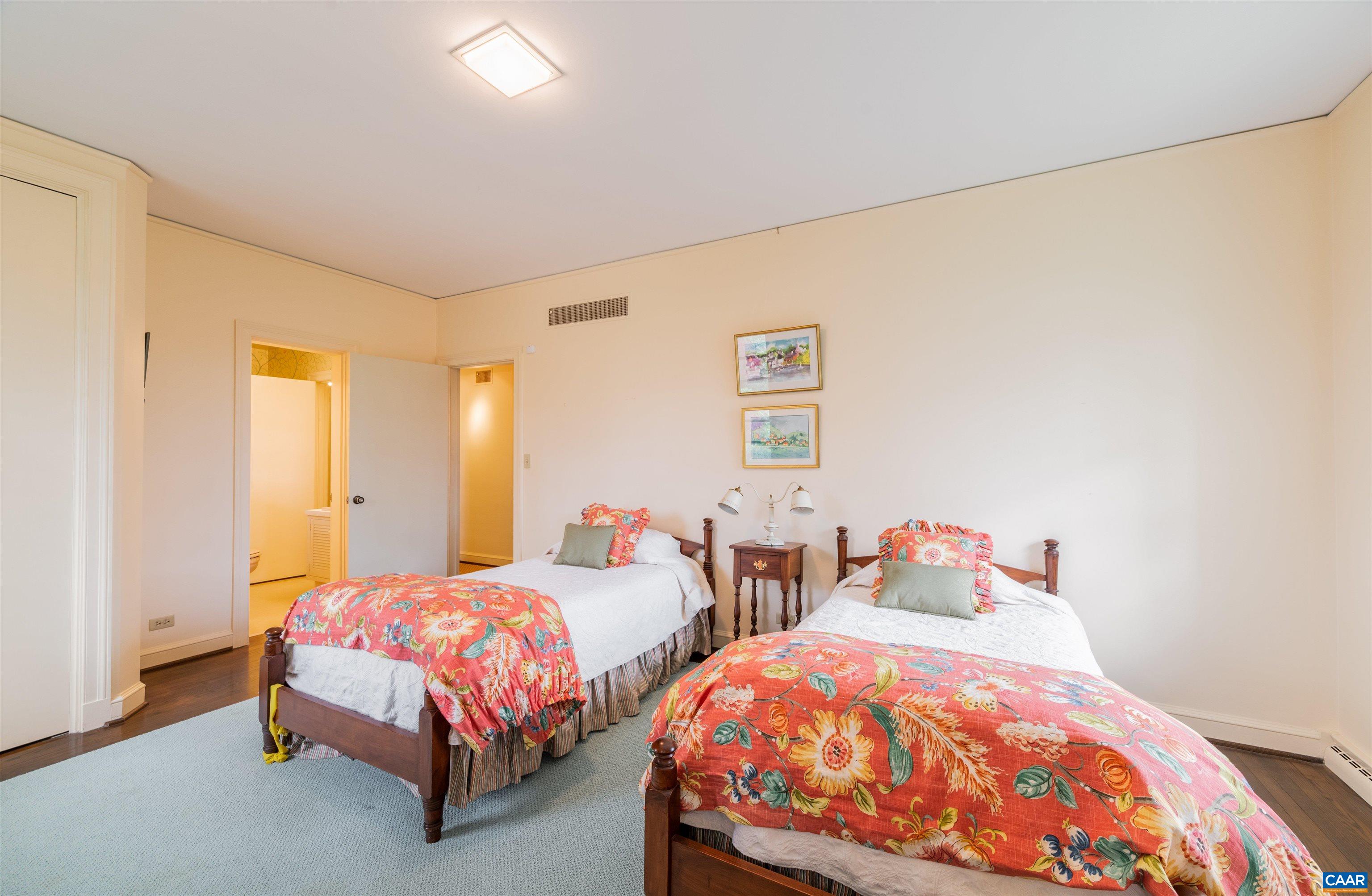 275 Terrell Road West Charlottesville, VA 22901 - Photo 44 of 68 a bedroom with two beds and a lamp
