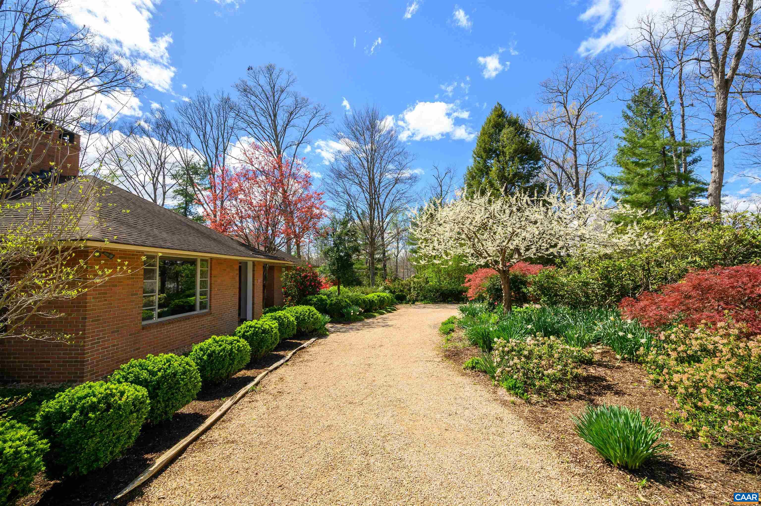 275 Terrell Road West Charlottesville, VA 22901 - Photo 47 of 68 a front view of a house with plants and trees