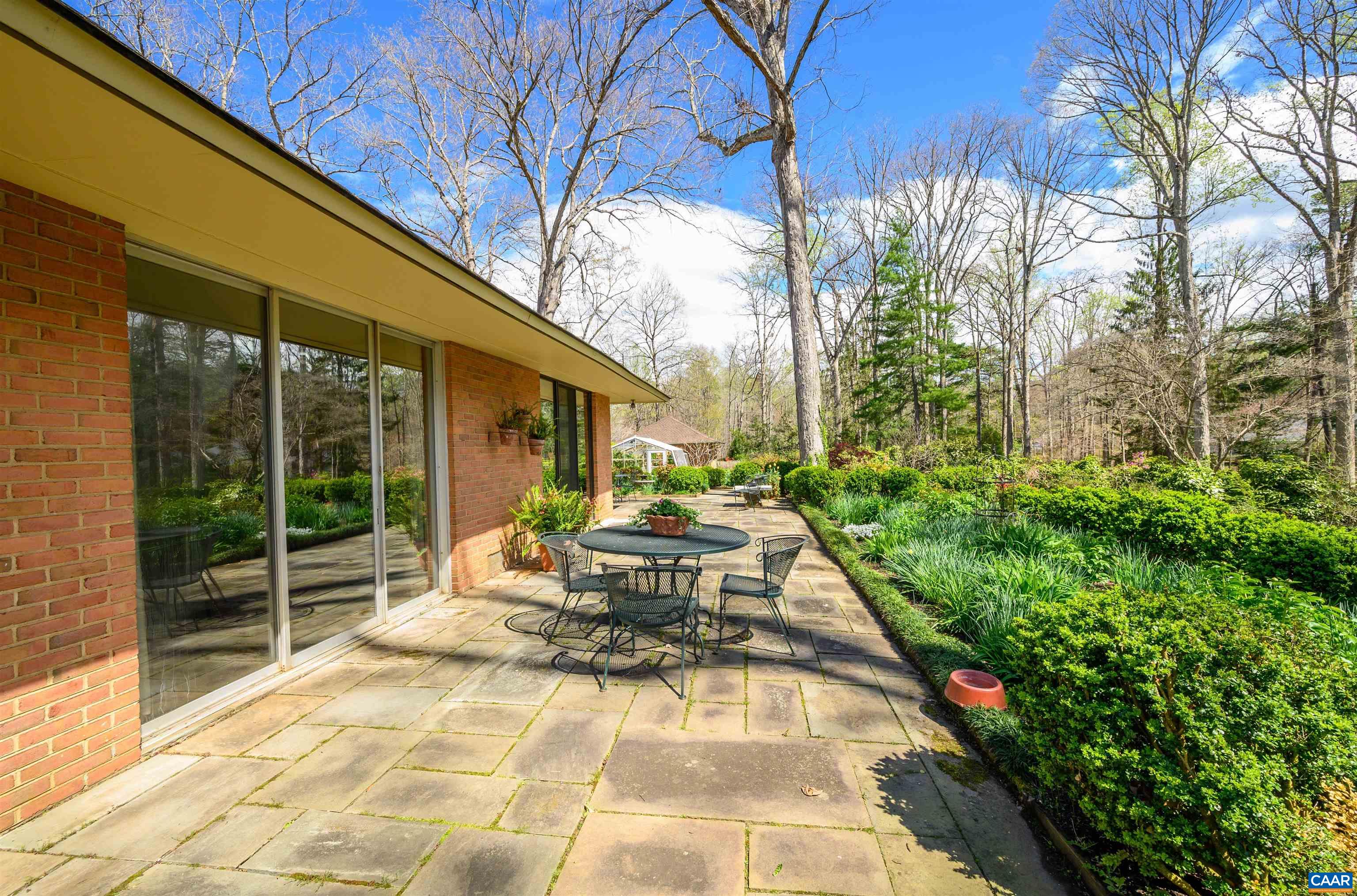 275 Terrell Road West Charlottesville, VA 22901 - Photo 58 of 68 a view of a patio with table and chairs and potted plants
