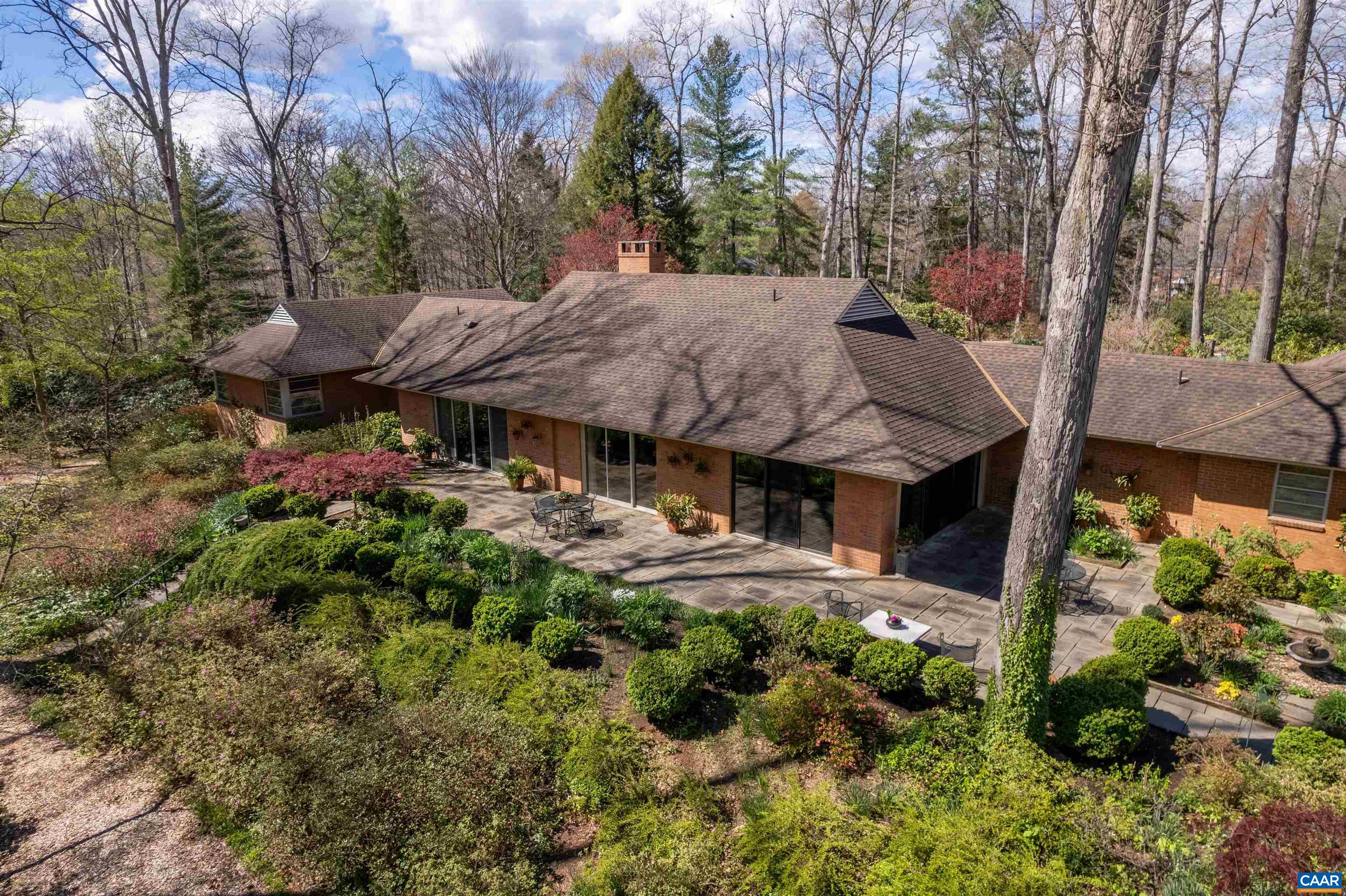 275 Terrell Road West Charlottesville, VA 22901 - Photo 60 of 68 a view of a house with a plants and large trees
