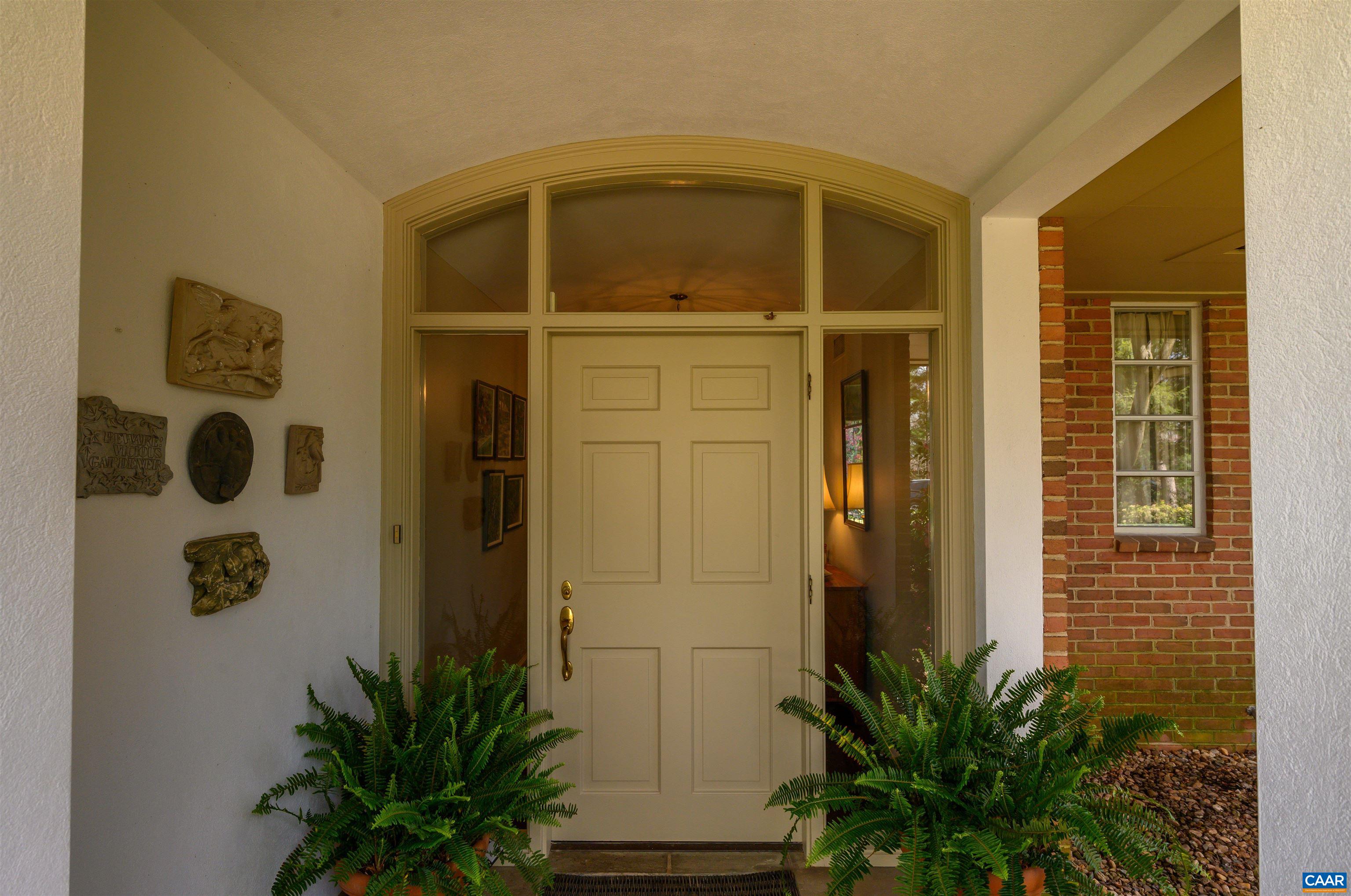 275 Terrell Road West Charlottesville, VA 22901 - Photo 10 of 68 a front view of a house with a glass door shower and potted plants