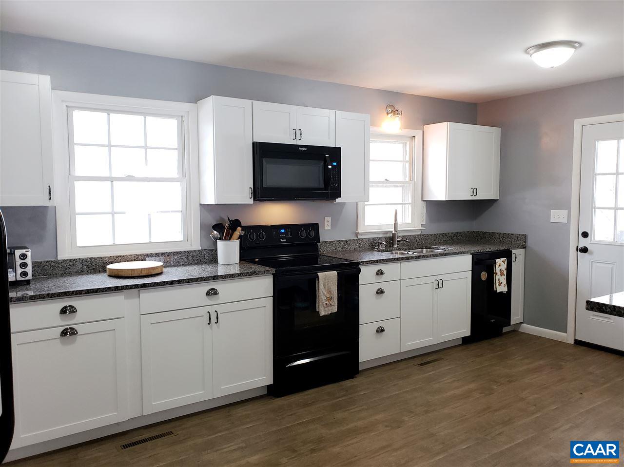 1141 Good Hope Church Road Aroda, VA 22709 - Photo 6 of 17 a kitchen with granite countertop white cabinets sink and window