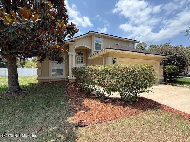 830 South Lilac Loop St. Johns, FL 32259 - Photo 1 of 40 a front view of a house with a yard