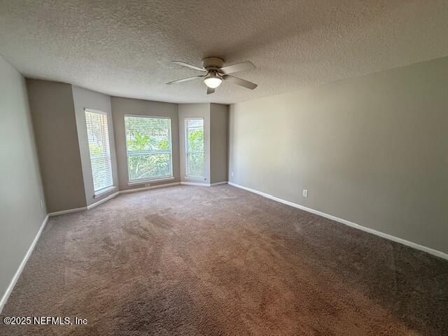 830 South Lilac Loop St. Johns, FL 32259 - Photo 18 of 40 an empty room with windows and ceiling fan