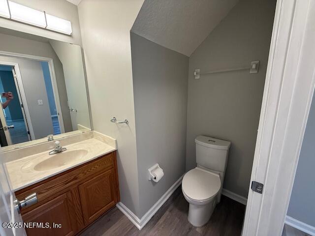 830 South Lilac Loop St. Johns, FL 32259 - Photo 20 of 40 a bathroom with a toilet a sink and a mirror