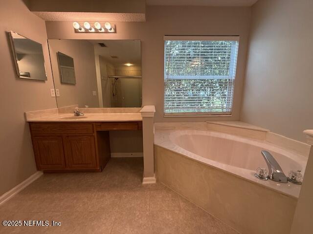 830 South Lilac Loop St. Johns, FL 32259 - Photo 22 of 40 a spacious bathroom with a tub a sink and a large mirror