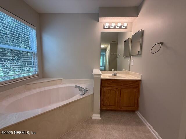 830 South Lilac Loop St. Johns, FL 32259 - Photo 23 of 40 a bathroom with a bathtub sink and mirror