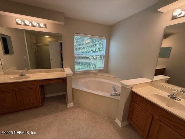 830 South Lilac Loop St. Johns, FL 32259 - Photo 25 of 40 a bathroom with a granite countertop sink and a bathtub