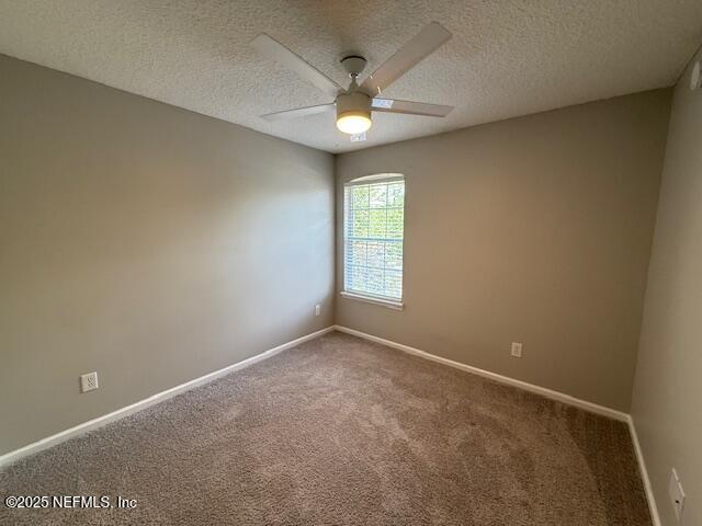 830 South Lilac Loop St. Johns, FL 32259 - Photo 30 of 40 an empty room with a window and a ceiling fan