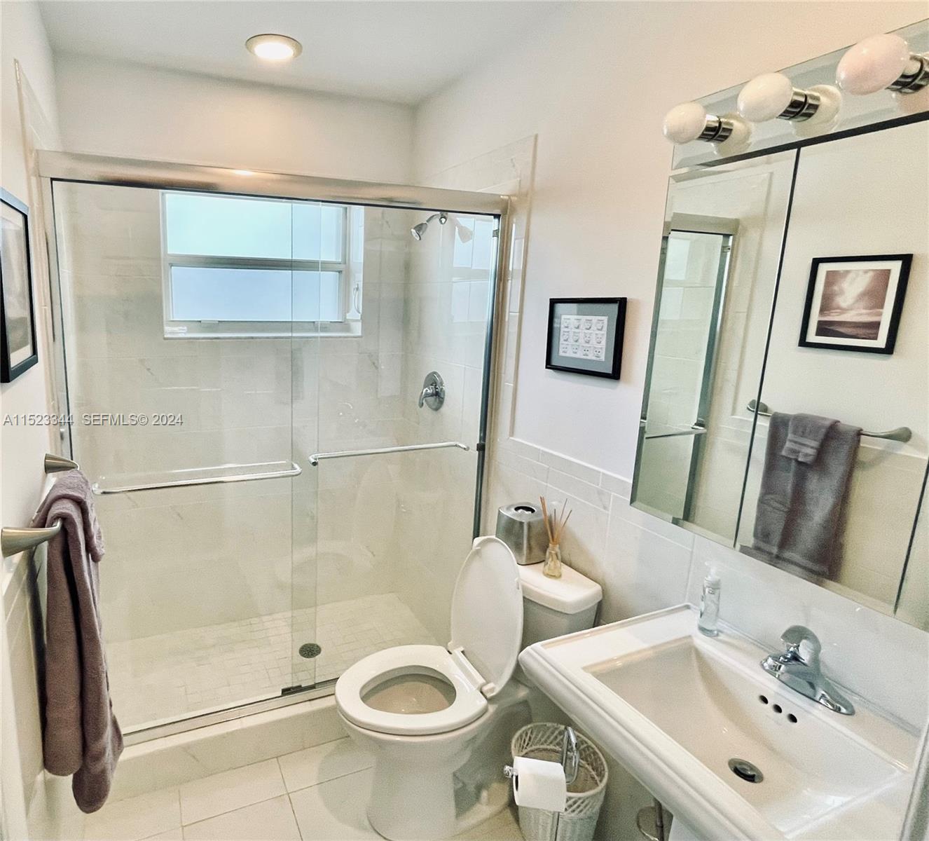 331 Desoto Street Hollywood, FL 33019 - Photo 11 of 12 a bathroom with a sink and a mirror