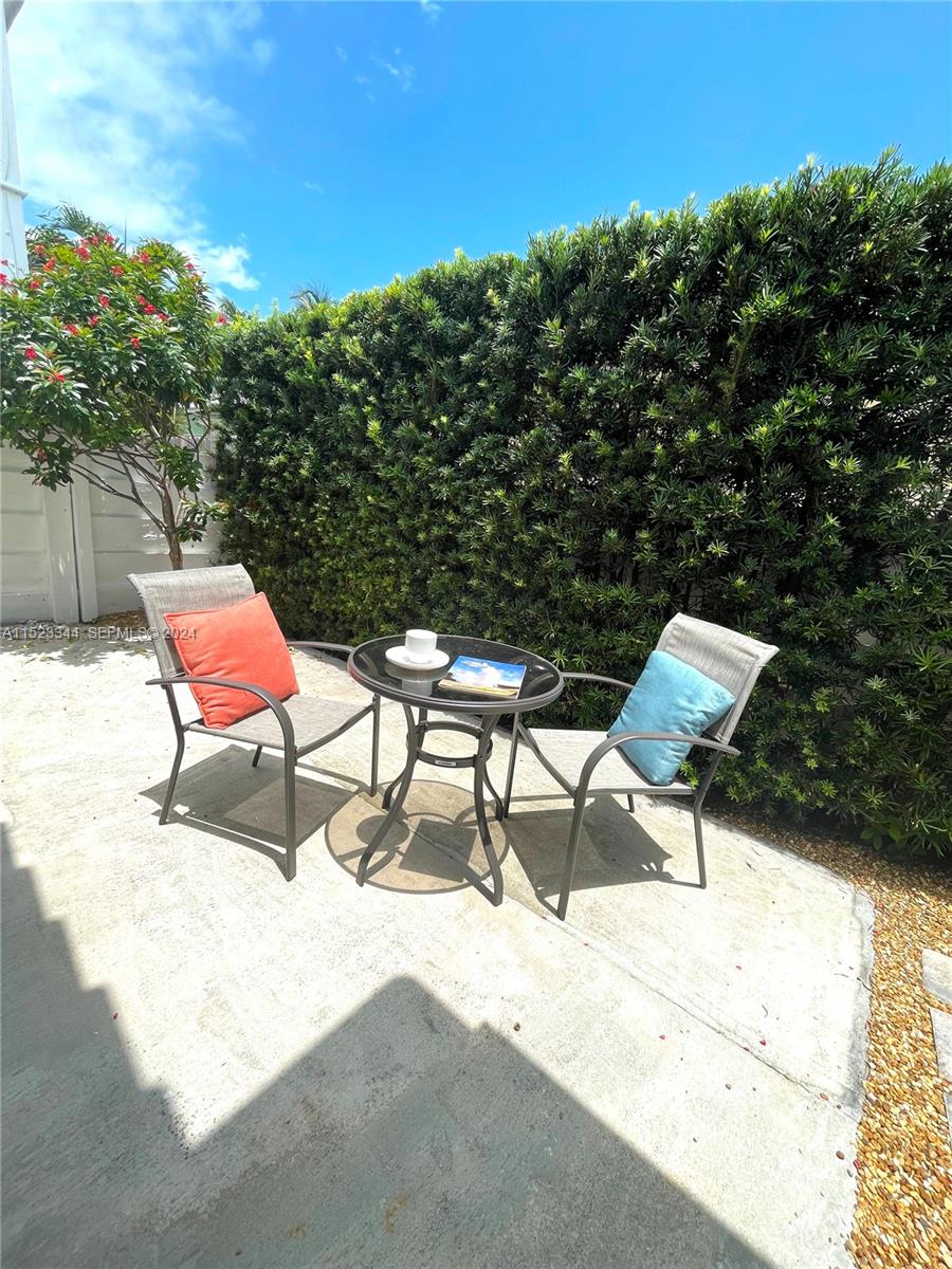 331 Desoto Street Hollywood, FL 33019 - Photo 5 of 12 a view of a two chairs in the roof deck