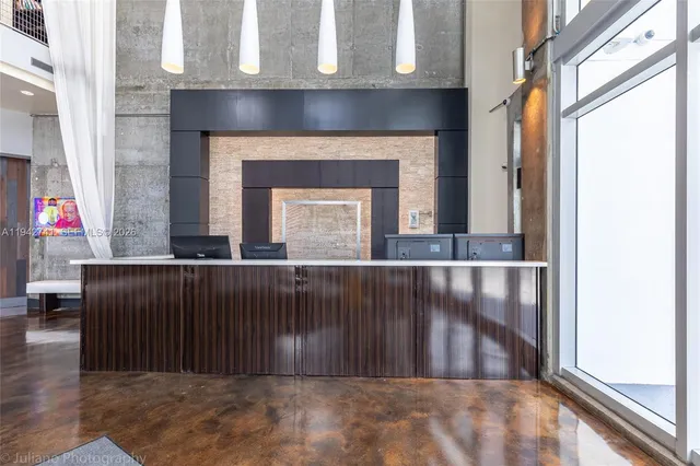 a living room with furniture pool table and flat screen tv
