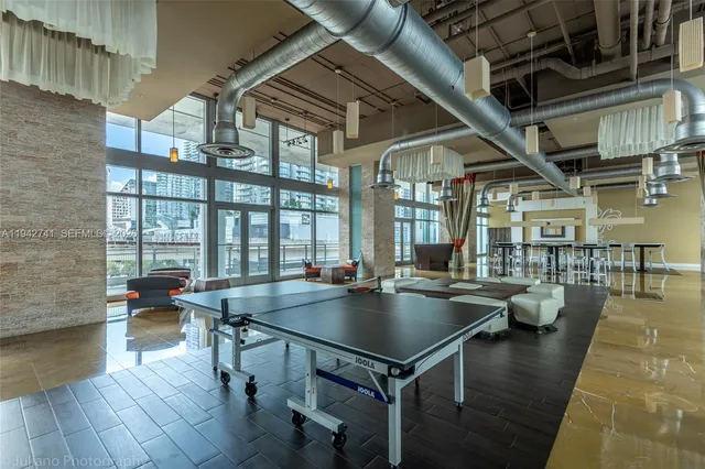 a view of a swimming pool with outdoor seating