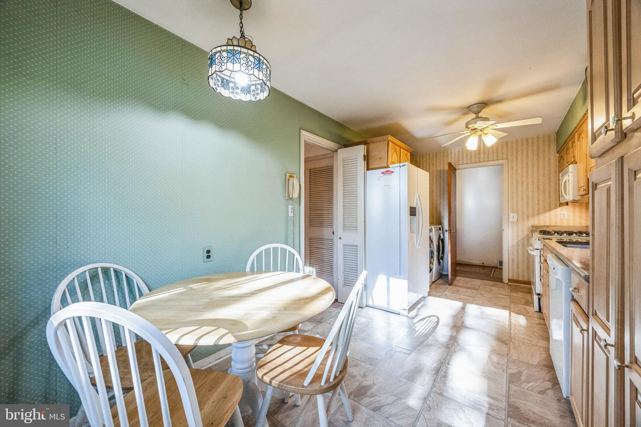 1246 Forge Road Cherry Hill, NJ 08034 - Photo 11 of 34 a spacious bedroom with a bed and a chandelier
