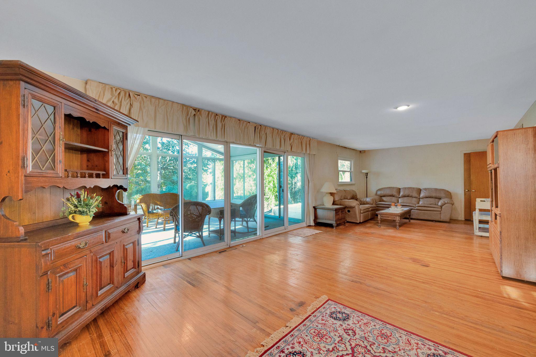 1246 Forge Road Cherry Hill, NJ 08034 - Photo 16 of 34 a living room with furniture fireplace and a large window